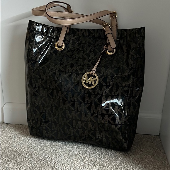 Michael Kors Handbags - Michael Kors Black and Tan Monogram Tote - like new condition hardly used